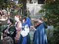 Kansas City USA - group of singers with instruments dressed in renassiance clothinging sing with lattice